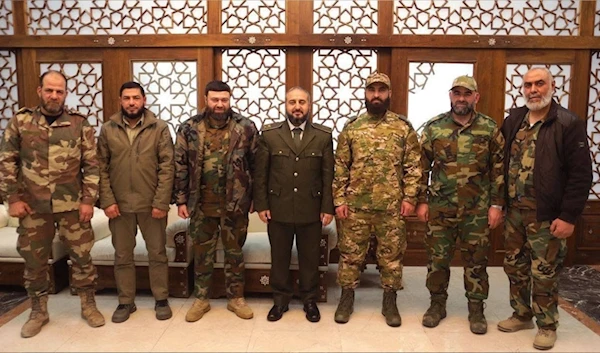 Members of Syria's Ministry of Defense pose for a picture with faction leaders. (@sayed_ridha)