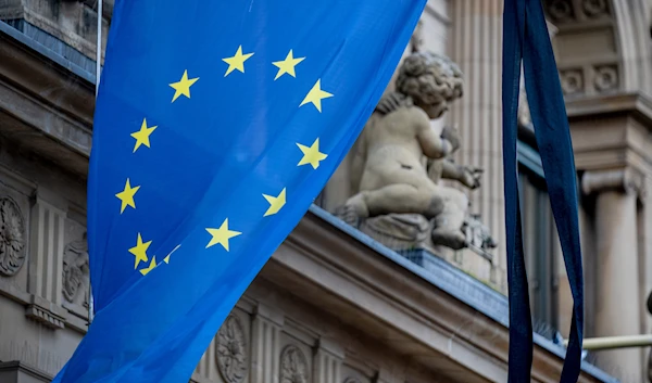 Black ribbons are fixed to the European flag at the stock market in Frankfurt, Germany, on February 24, 2022. (AP)