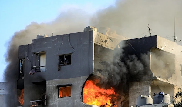 A fire burns in building targeted by an Israeli air strike in Beirut’s southern Suburb of Chiah, on October 22, 2024. (AFP)