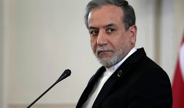 Iranian Foreign Minister Abbas Araghchi listens to a question in a joint press briefing with his Omani counterpart Sayyid Badr Albusaidi after their meeting in Tehran, Iran, Monday, Dec. 30, 2024 (AP)