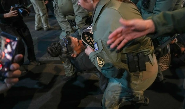 Police scuffle with demonstrators who block a road during a protest demanding a cease-fire deal and the immediate release of captives held in the Gaza Strip by Hamas, in Tel Aviv, occupied Palestine, Saturday, Jan. 11, 2025 (AP)