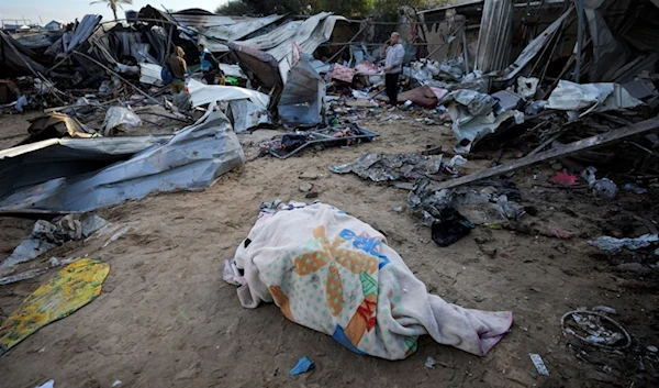 A body recovered lies on the ground at the Mawasi camp near Khan Younis, in the southern Gaza Strip, on December 5, 2024. (AP)