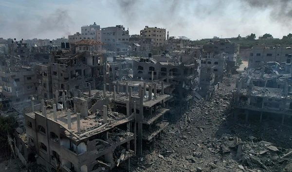 A view of the rubble of buildings hit by an Israeli airstrike, in Jabalia, Gaza strip, on October 11, 2023. (AP)