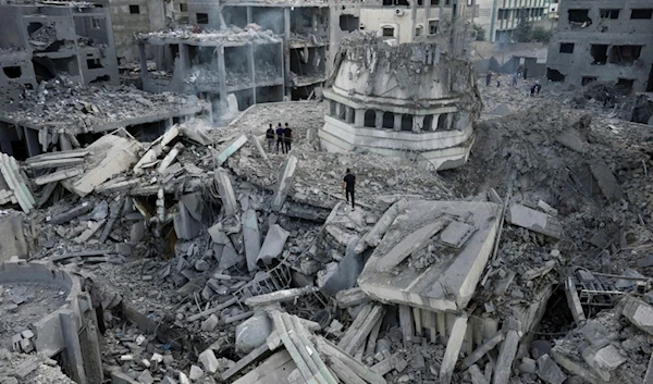 Palestinians inspect the rubble of the Yassin Mosque after it was hit by an Israeli airstrike at Shati refugee camp in Gaza City, on Oct. 9, 2023. (AP)