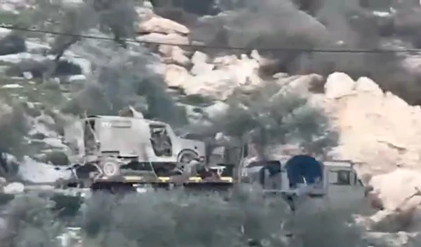 Israeli occupation forces withdrawing a military vehicle that was blown up by the Qabatiya Company of the Jenin Battalion, January 15, 2025 (Social Media)