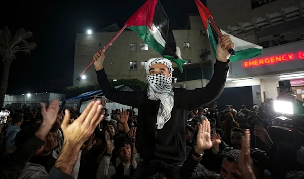 Palestinians celebrate the announcement of a ceasefire deal between Hamas and the Israeli occupation in Deir al-Balah, central Gaza Strip, Wednesday, January 15, 2025 (AP)