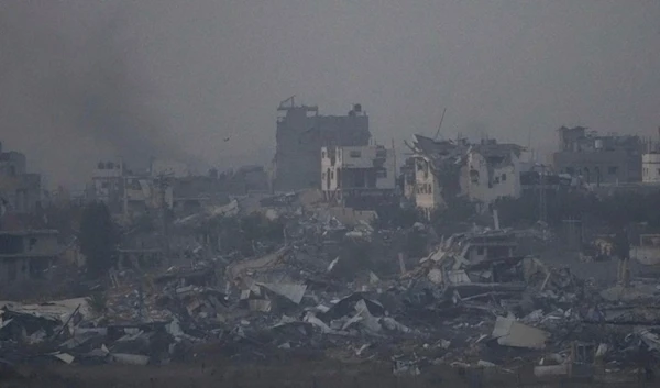 Destroyed buildings by Israeli bombardments as seen inside the Gaza Strip from southern Israel, Thursday, Jan. 16, 2025. (AP Photo/Ariel Schalit)