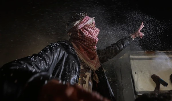 Palestinians celebrate the imminent announcement of a ceasefire deal, in Khan Younis, central Gaza Strip, Wednesday, Jan. 15, 2025. (AP)