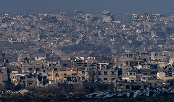 Destroyed buildings by Israeli bombardments as seen inside the Gaza Strip from the occupied territories, Thursday, Jan. 16, 2025. (AP Photo/Ariel Schalit)