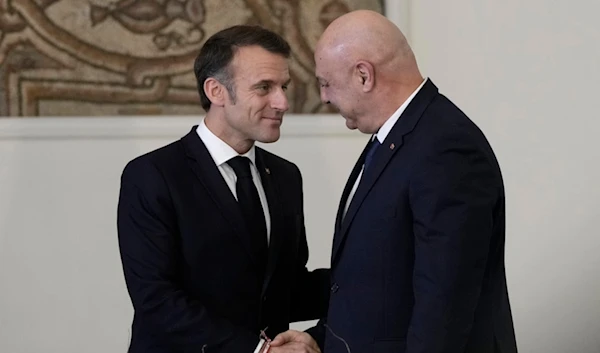 Lebanese President Joseph Aoun, right, shakes hands with French President Emmanuel Macron after their news conference at the presidential palace in Baabda, in east of Beirut, Lebanon, Friday, Jan. 17, 2025. (AP)