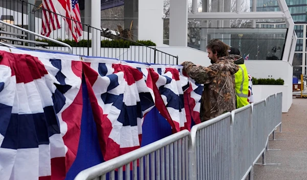 Work continues near the presidential reviewing stand on Pennsylvania Avenue outside the White House, Friday, Jan. 17, 2025, in Washington, ahead of President-elect Donald Trump's inauguration (AP)