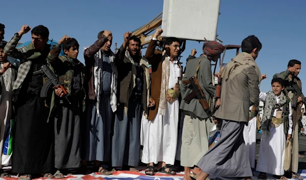 Yemenis step on an American flag during an anti-US and Israeli occupation rally in Sanaa, Yemen, Friday, Jan. 17, 2025 (AP)