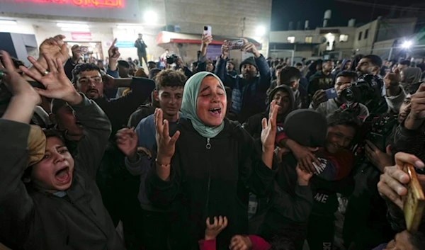 Palestinians celebrate the announcement of a ceasefire deal between Hamas and the Israeli occupation in Deir al-Balah, central Gaza Strip, Wednesday, January 15, 2025 (AP)