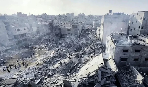 Palestinians check destruction in the aftermath of an Israeli strike on the Jabalia refugee camp in the Gaza Strip on November 1. (AFP via Getty Images)