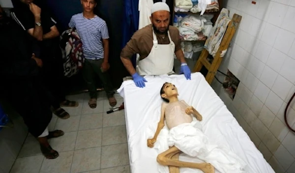 Palestinian child Abdul Qader al-Sarhi’s lifeless body at the morgue of the Al-Aqsa Martyrs Hospital in Deir al-Balah, Gaza, on May 31, 2024 (Social media)