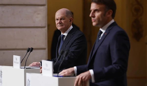 French President Emmanuel Macron, right, and German Chancellor Olaf Scholz give a joint statement at the Elysee Palace in Paris, Wednesday, Jan. 22 2025 (EPA via AP)