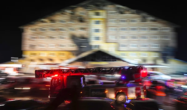 A firefighting truck leaves the scene where a fire broke out at a hotel in the ski resort of Kartalkaya, located in Bolu province, northwest Turkey, on January 21, 2025. (AP)