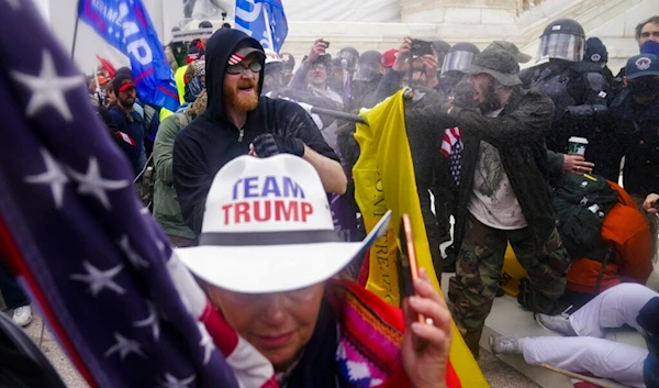 In this Jan. 6, 2021, file photo, insurrections loyal to President Donald Trump try to break through a police barrier at the Capitol in Washington, DC (AP)