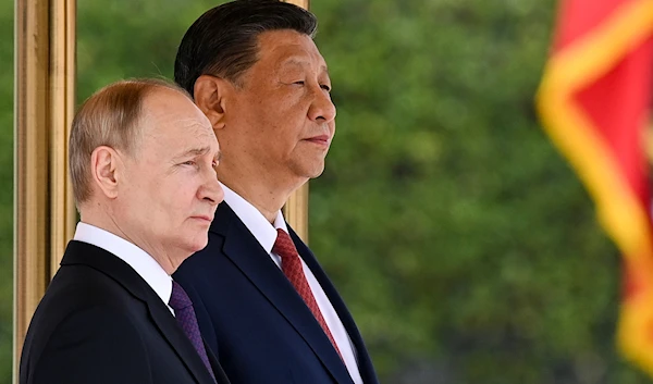 Chinese President Xi Jinping, right, and Russian President Vladimir Putin attend an official welcome ceremony in Beijing, China, on May 16, 2024. (Sergei Bobylev, Sputnik, Kremlin Pool Photo via AP)