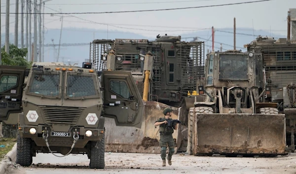 Israeli occupation forces vehicles are seen during a military operation in the West Bank city of Jenin, Wednesday, Jan. 22, 2025 (AP)