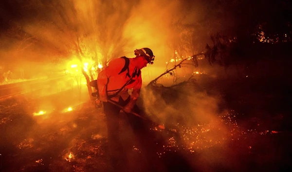 Firefighter Chris Fritz works to keep the Aero Fire from spreading through the Copperopolis community of Calaveras Country, Calif, on Monday, June 17, 2024. (AP)