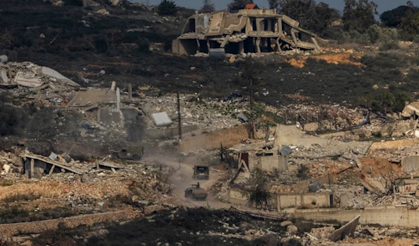 Israeli soldiers drive inside a village in southern Lebanon, as seen form northern occupied Palestine, Thursday, Jan. 23, 2025 (AP)