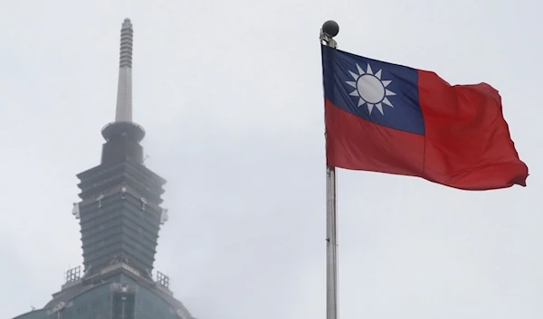 A Taiwan national flag flutters near the Taipei 101 building at the National Dr. Sun Yat-Sen Memorial Hall in Taipei, Taiwan, May 7, 2023. (AP)