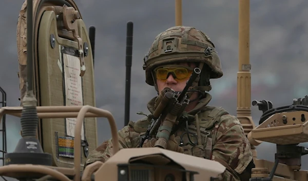 A British soldier with NATO-led Resolute Support Mission forces arrives at the site of an attack in Kabul, Afghanistan, Wednesday, March 25, 2020. (AP)