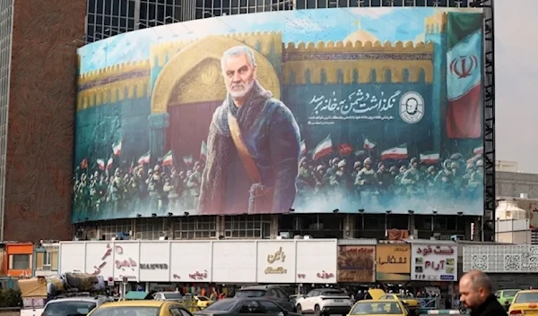 A large panel showing an illustration of martyr Soleimani in Tehran’s Valiasr Square. (AFP)