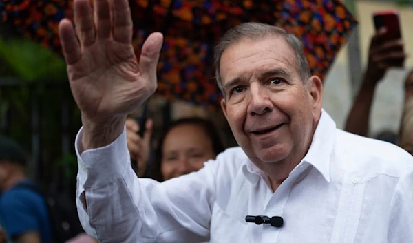 The Venezuela opposition presidential candidate, Edmundo Gonzalez, waves to supporters during a political event in June. (AP)