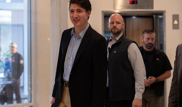 Canada Prime Minister Justin Trudeau walks through the lobby of the Delta Hotel by Marriott, Saturday, November 30, 2024, in West Palm Beach, Florida (AP)