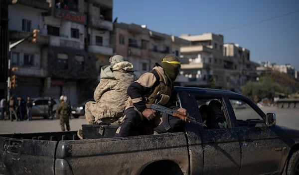 Members of the new security forces take part in an operation to detain men suspected of being part of militias or Syrian Arab Army soldiers in Homs, Syria, Friday, January 3, 2025 (AP)